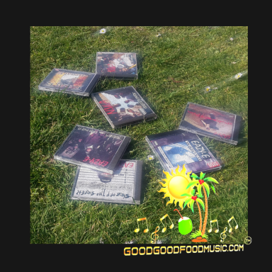 A collection of sEVEN Ruthless Records CDs arranged on grass